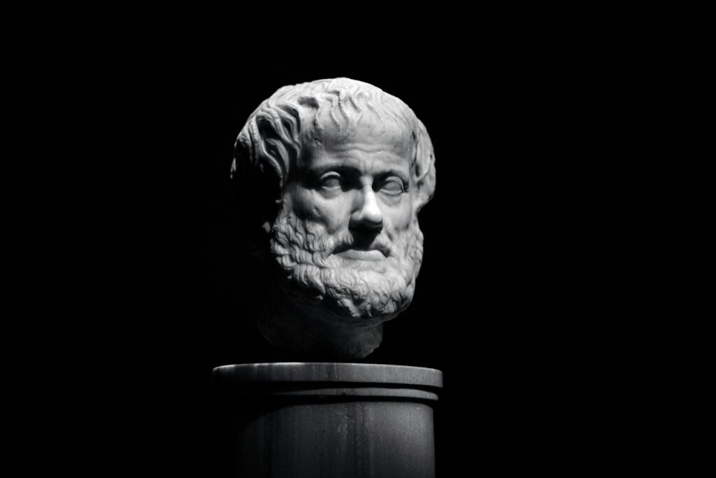 A black and white photo of a bust of a man